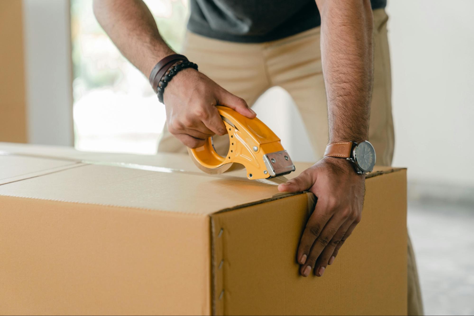 Image of a man moving out of a rental apartment.